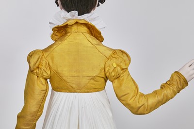 Lot 114 - A yellow silk twill gros de Tours silk spencer, probably English, 1815-17