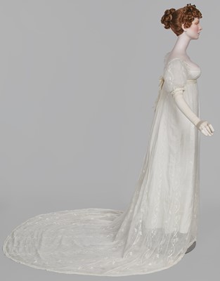 Lot 34 - A whitework embroidered muslin evening gown with long trained hem, French, 1800-04