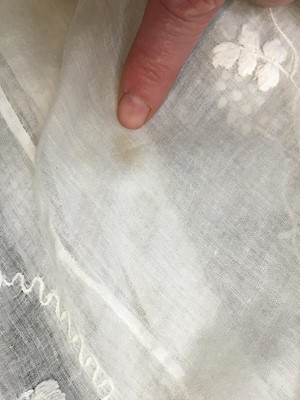 Lot 34 - A whitework embroidered muslin evening gown with long trained hem, French, 1800-04