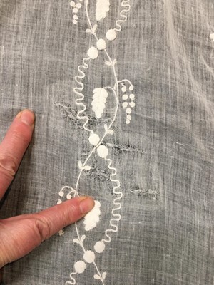 Lot 34 - A whitework embroidered muslin evening gown with long trained hem, French, 1800-04