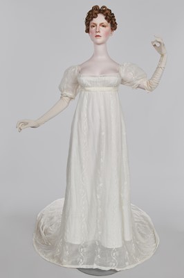 Lot 34 - A whitework embroidered muslin evening gown with long trained hem, French, 1800-04