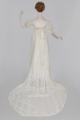 Lot 34 - A whitework embroidered muslin evening gown with long trained hem, French, 1800-04