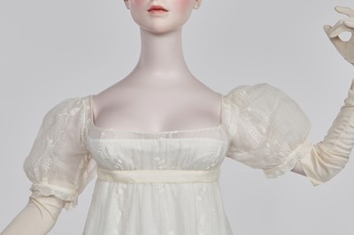 Lot 34 - A whitework embroidered muslin evening gown with long trained hem, French, 1800-04