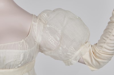 Lot 34 - A whitework embroidered muslin evening gown with long trained hem, French, 1800-04