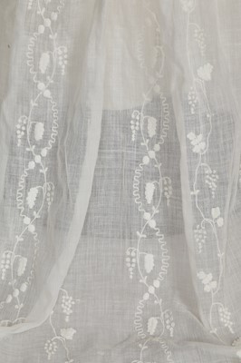 Lot 34 - A whitework embroidered muslin evening gown with long trained hem, French, 1800-04