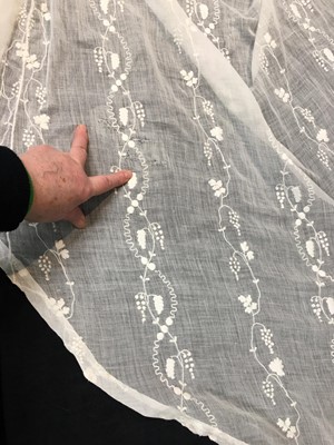 Lot 34 - A whitework embroidered muslin evening gown with long trained hem, French, 1800-04