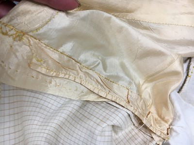 Lot 111 - A pale apricot sarsanet redingote/pelisse, French, circa 1815