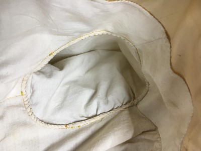 Lot 111 - A pale apricot sarsanet redingote/pelisse, French, circa 1815
