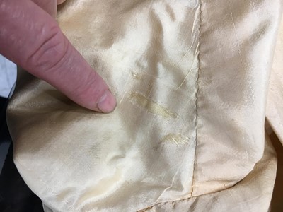 Lot 111 - A pale apricot sarsanet redingote/pelisse, French, circa 1815