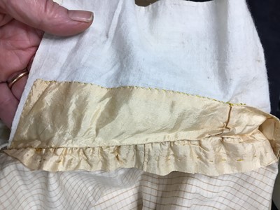 Lot 111 - A pale apricot sarsanet redingote/pelisse, French, circa 1815