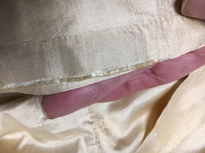 Lot 111 - A pale apricot sarsanet redingote/pelisse, French, circa 1815