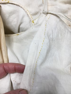 Lot 111 - A pale apricot sarsanet redingote/pelisse, French, circa 1815