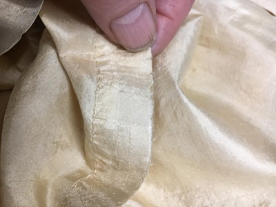 Lot 111 - A pale apricot sarsanet redingote/pelisse, French, circa 1815
