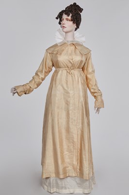 Lot 111 - A pale apricot sarsanet redingote/pelisse, French, circa 1815
