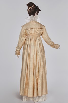 Lot 111 - A pale apricot sarsanet redingote/pelisse, French, circa 1815
