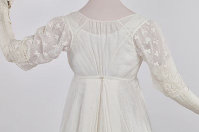 Lot 37 - A fine white muslin gown with long train, French, circa 1803