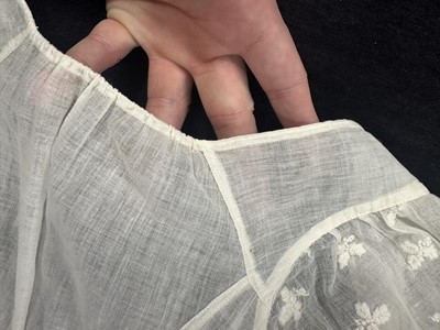 Lot 37 - A fine white muslin gown with long train, French, circa 1803