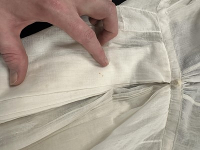 Lot 37 - A fine white muslin gown with long train, French, circa 1803