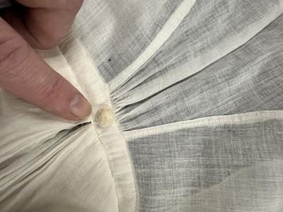 Lot 37 - A fine white muslin gown with long train, French, circa 1803