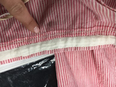 Lot 50 - A pink and white striped cotton cambric spencer and petticoat, English, circa 1807-09