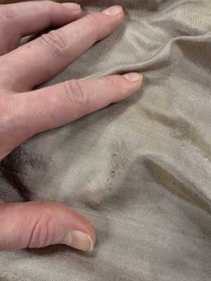 Lot 95 - A taupe twill shot sarsanet evening dress, circa 1812