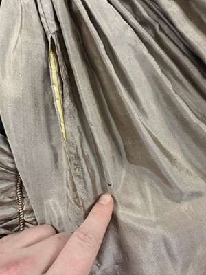 Lot 95 - A taupe twill shot sarsanet evening dress, circa 1812