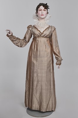 Lot 95 - A taupe twill shot sarsanet evening dress, circa 1812