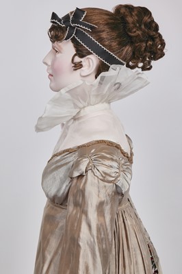 Lot 95 - A taupe twill shot sarsanet evening dress, circa 1812