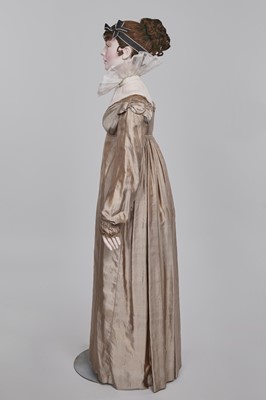 Lot 95 - A taupe twill shot sarsanet evening dress, circa 1812