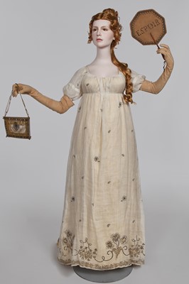 Lot 10 - A fine embroidered and spangled white linen evening gown, French, circa 1796