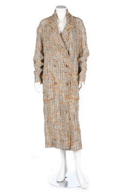 Lot 357 - A Chanel boutique tweed summer coat, 1998,...