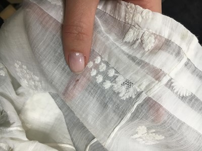 Lot 52 - A finely embroidered muslin evening dress, French, circa 1807