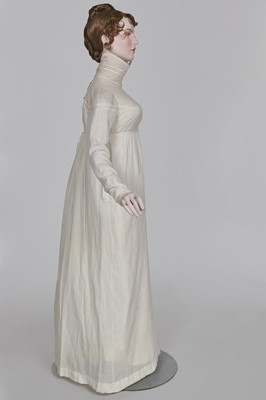 Lot 59 - A white self-striped cotton high dress, English, circa 1809