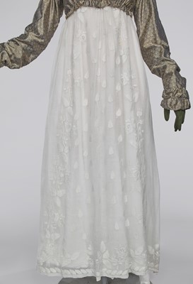 Lot 77 - A figured sarsanet spencer and muslin petticoat, English, circa 1810-15