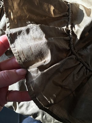 Lot 82 - A green-brown shot silk taffeta dress, French, circa 1810