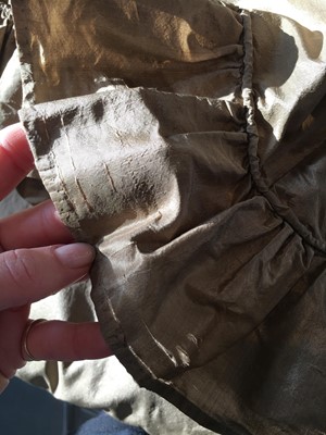 Lot 82 - A green-brown shot silk taffeta dress, French, circa 1810