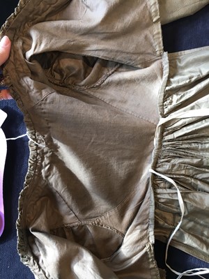 Lot 82 - A green-brown shot silk taffeta dress, French, circa 1810