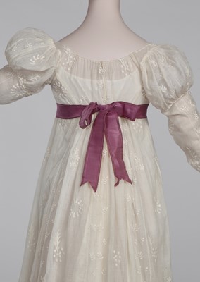 Lot 81 - A whiteworked muslin day dress, English, circa 1810