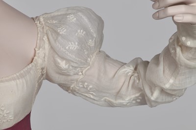 Lot 81 - A whiteworked muslin day dress, English, circa 1810