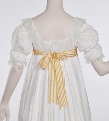 Lot 87 - A white cotton afternoon dress, English, circa 1812-13