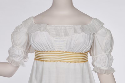 Lot 87 - A white cotton afternoon dress, English, circa 1812-13