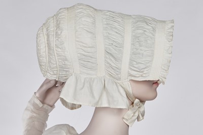 Lot 76 - A whiteworked muslin afternoon dress, English, circa 1810-12