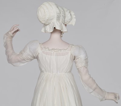 Lot 76 - A whiteworked muslin afternoon dress, English, circa 1810-12