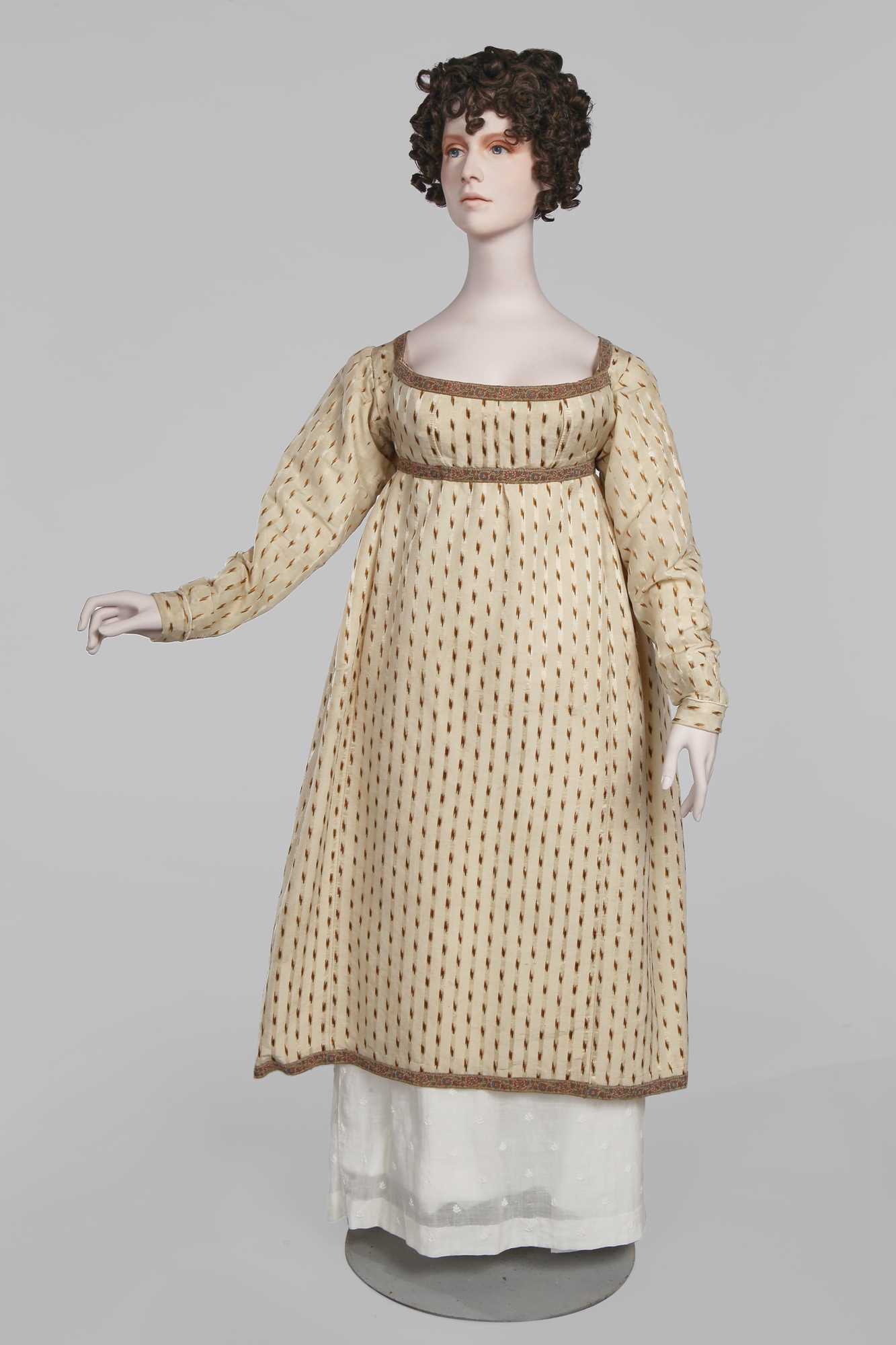 Lot 29 - A clouded satin-striped poplin over dress and a muslin gown, circa 1805