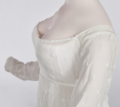 Lot 29 - A clouded satin-striped poplin over dress and a muslin gown, circa 1805