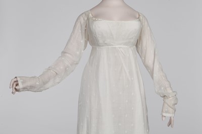 Lot 29 - A clouded satin-striped poplin over dress and a muslin gown, circa 1805