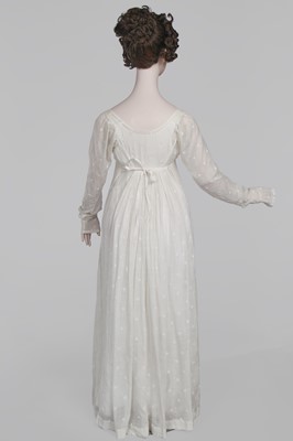 Lot 29 - A clouded satin-striped poplin over dress and a muslin gown, circa 1805