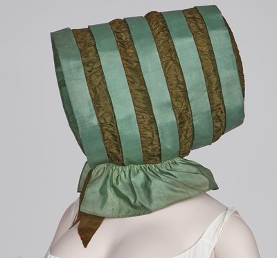 Lot 104 - A rare green silk poke bonnet/calash, circa 1806