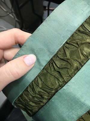 Lot 104 - A rare green silk poke bonnet/calash, circa 1806