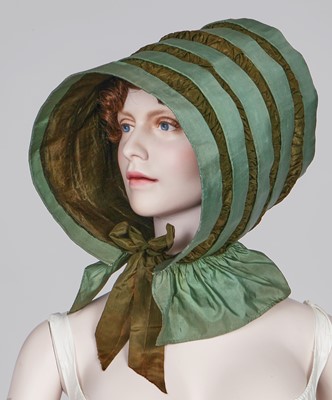 Lot 104 - A rare green silk poke bonnet/calash, circa 1806